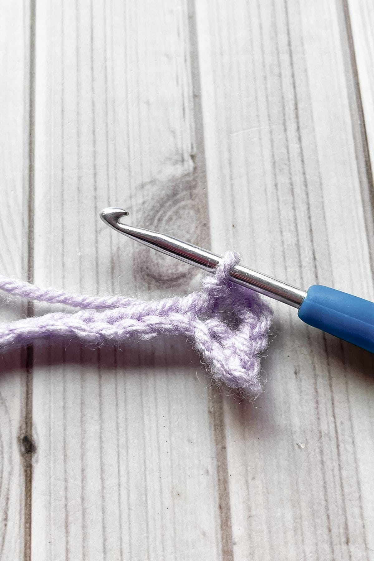 Making a sl st in the next stitch, with hook on table.