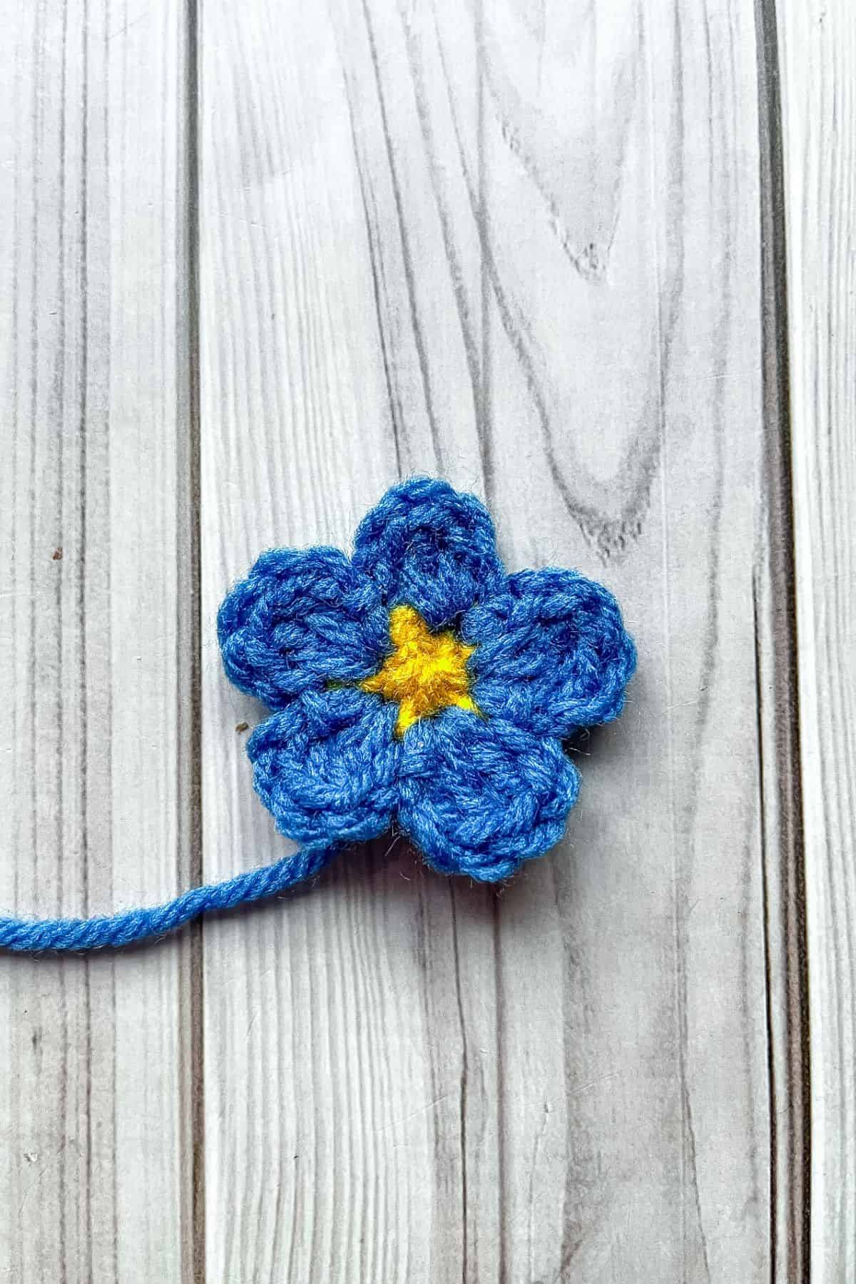 A crochet forget me not.