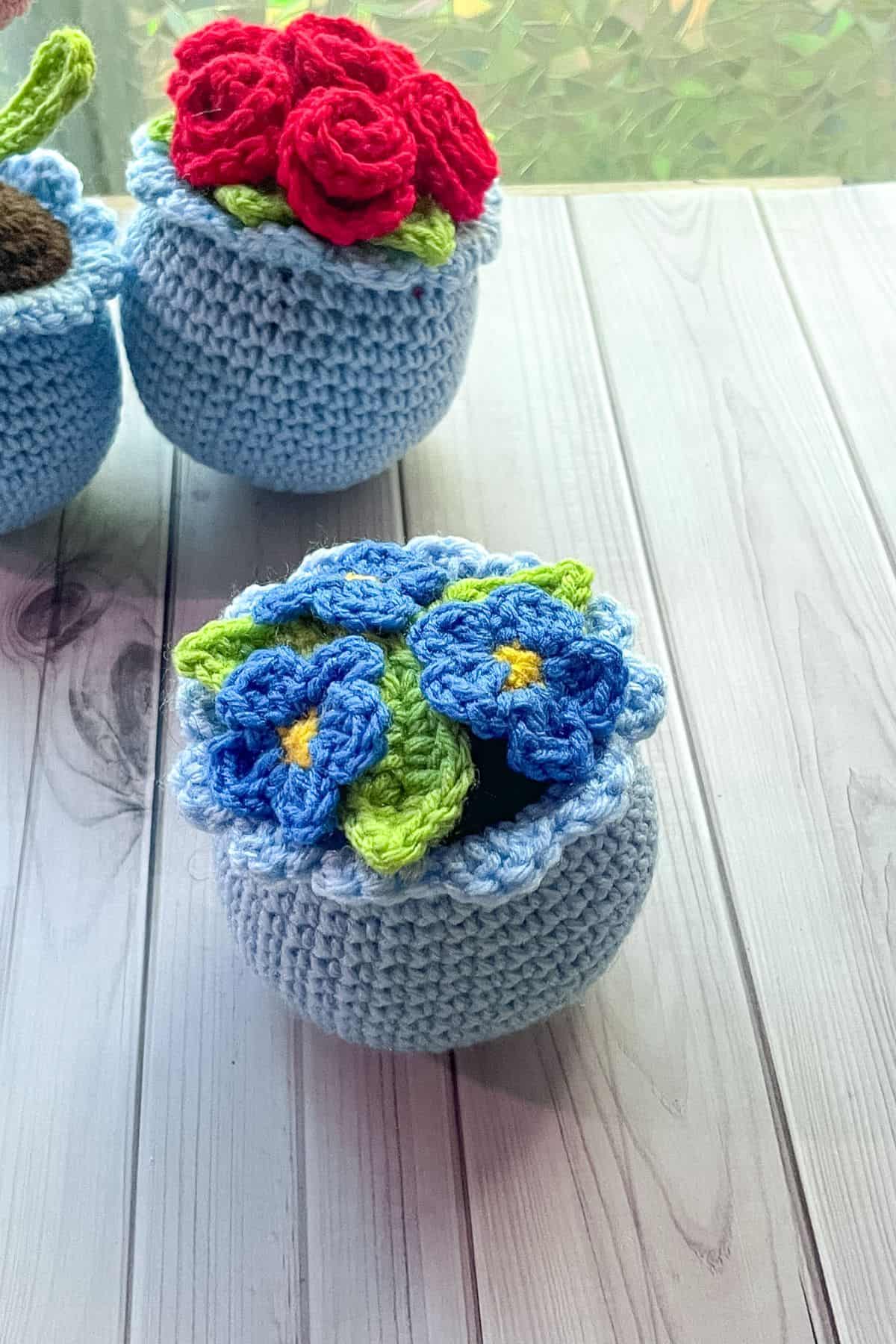 Finished crochet forget me not potted plant.