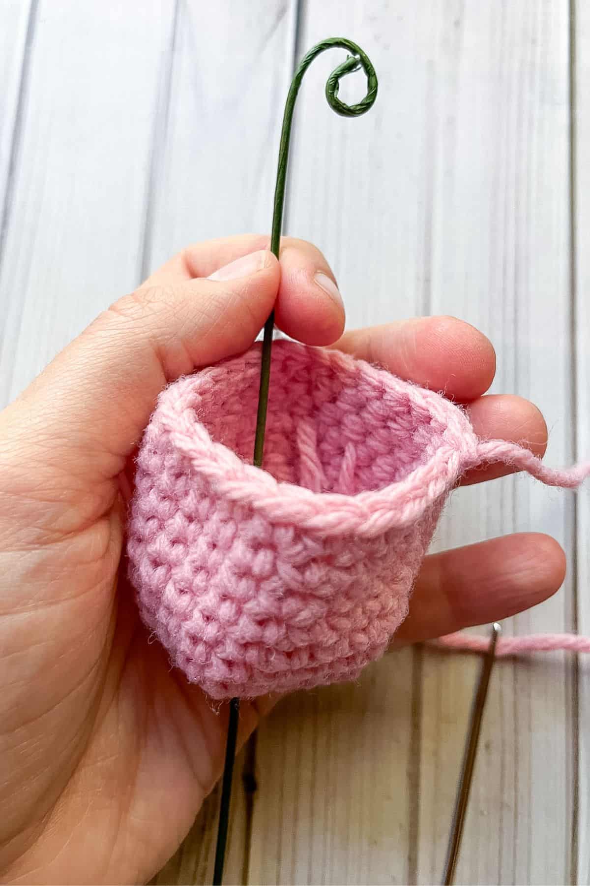Showing how to insert the wire into the tulip.