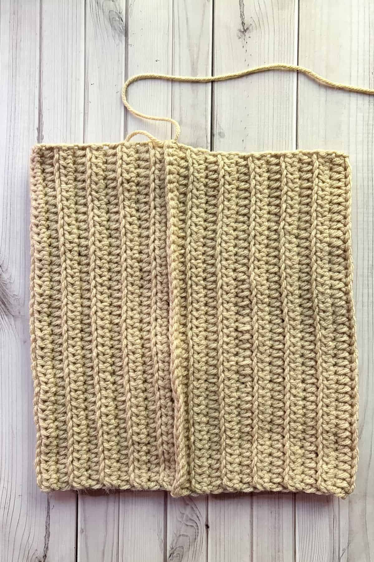 Crocheted rectangle into a tube.