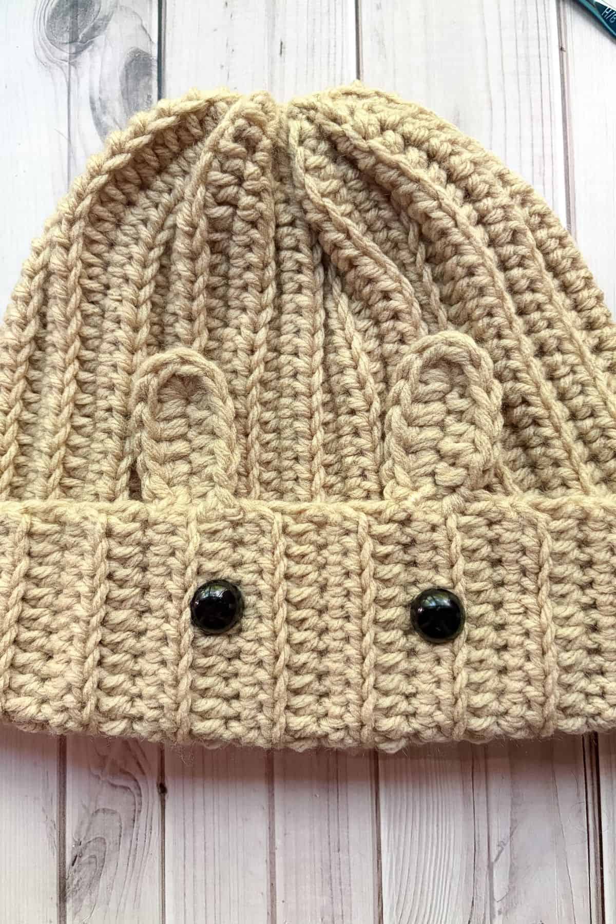 Sewn ears onto the hat.
