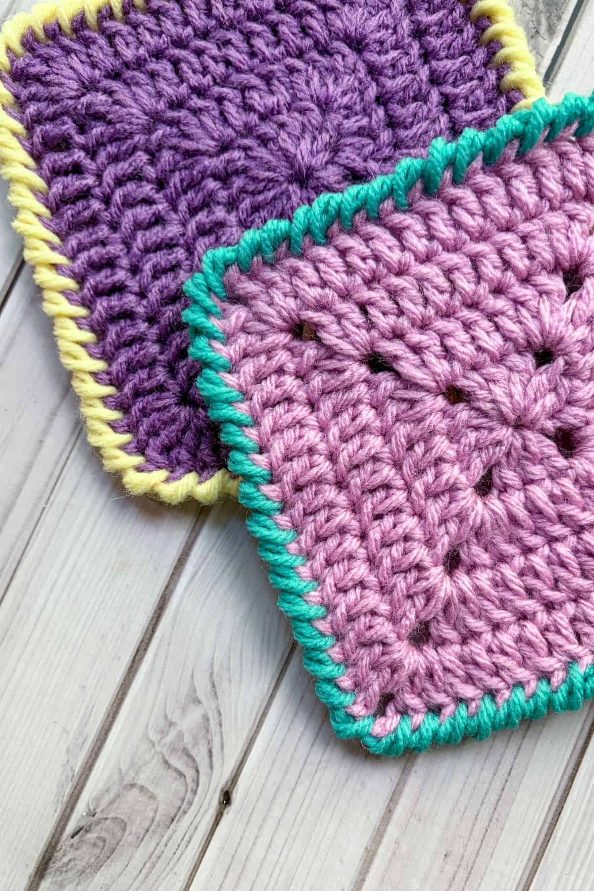 Finished crochet granny squares with crab stitch border.