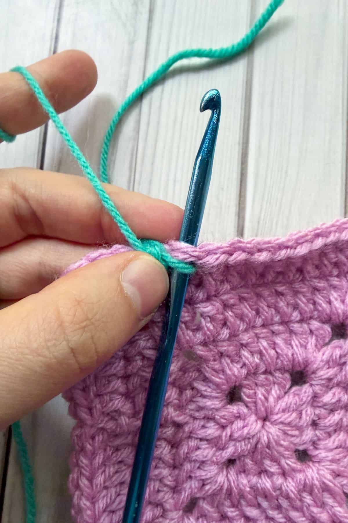 Making a reverse single crochet stitch.