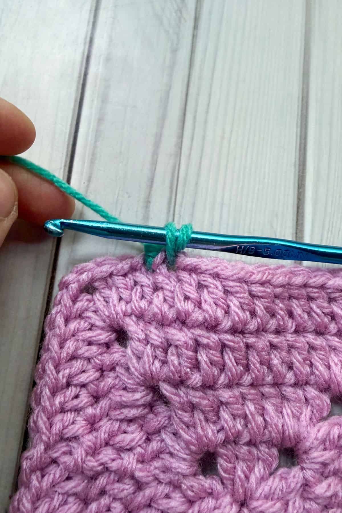 Making a reverse single crochet stitch.