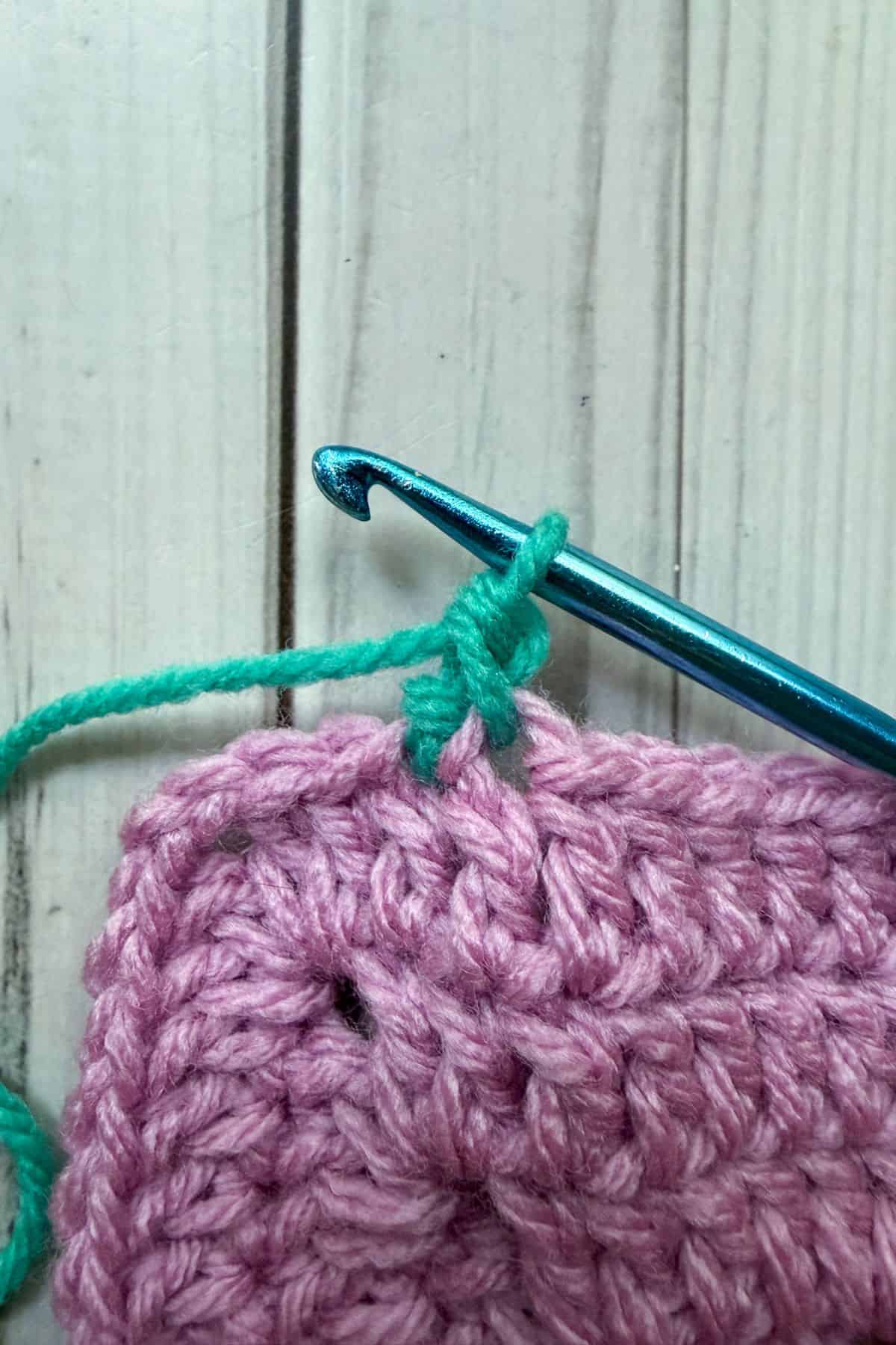 Making a reverse single crochet stitch.