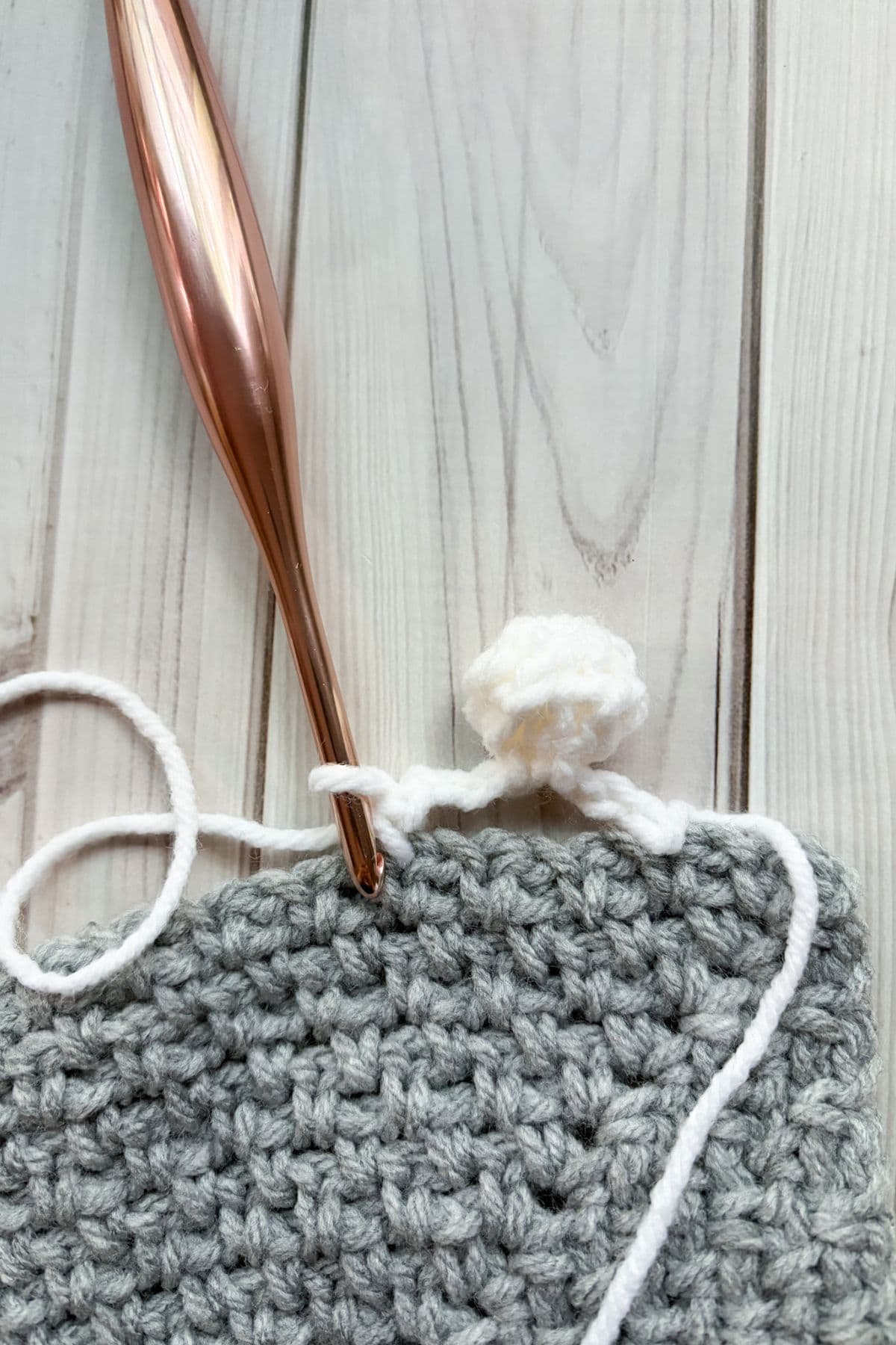 Finished crochet pom pom.
