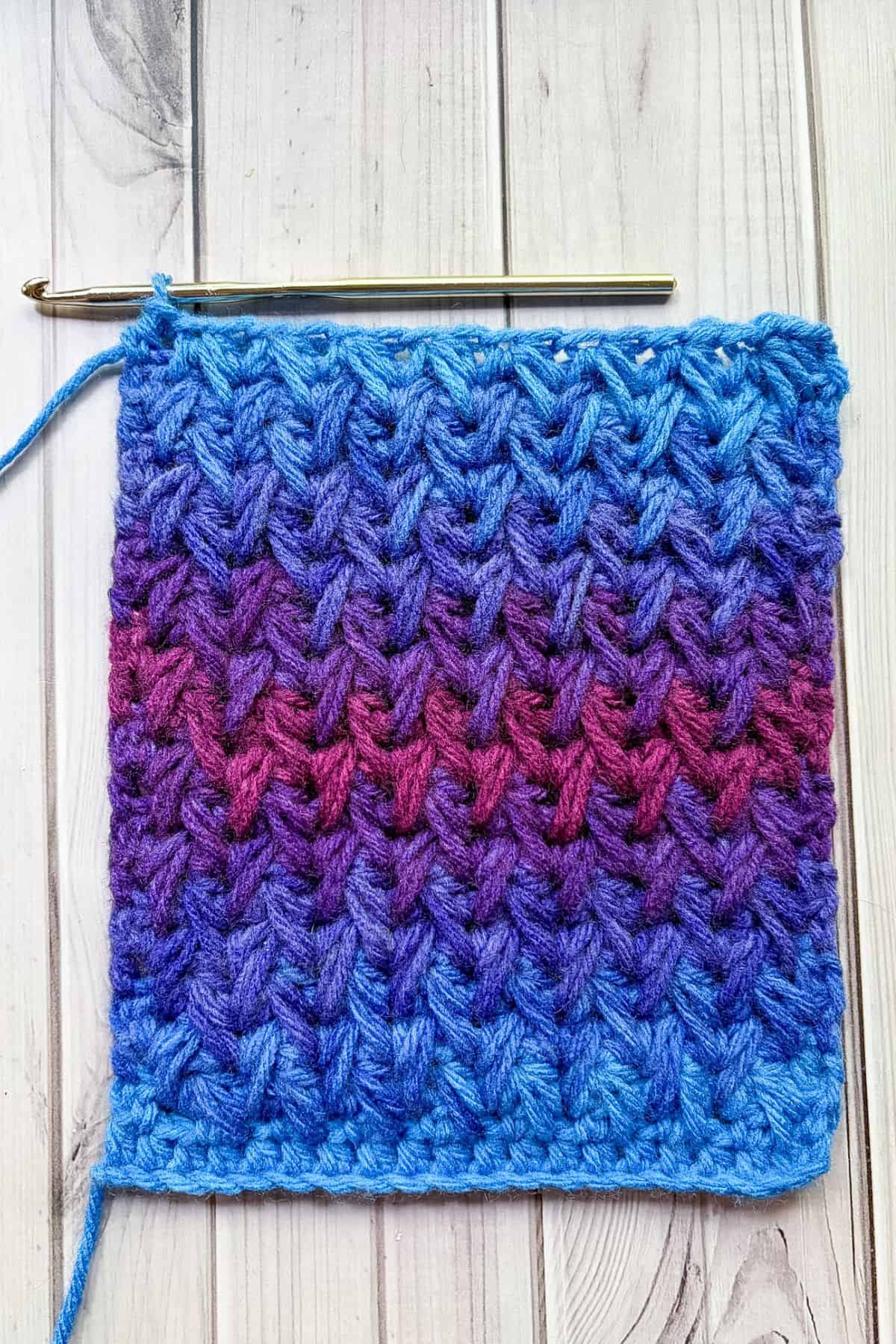 Finished crochet feather stitch swatch.