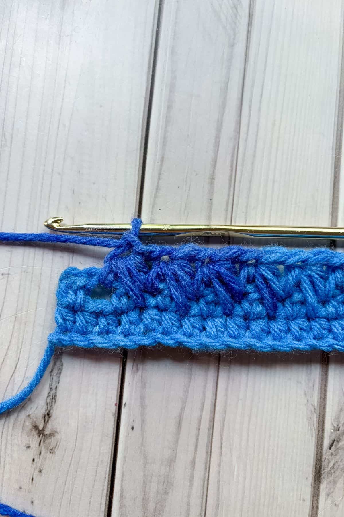 Finished row of feather stitches minus the last stitch.