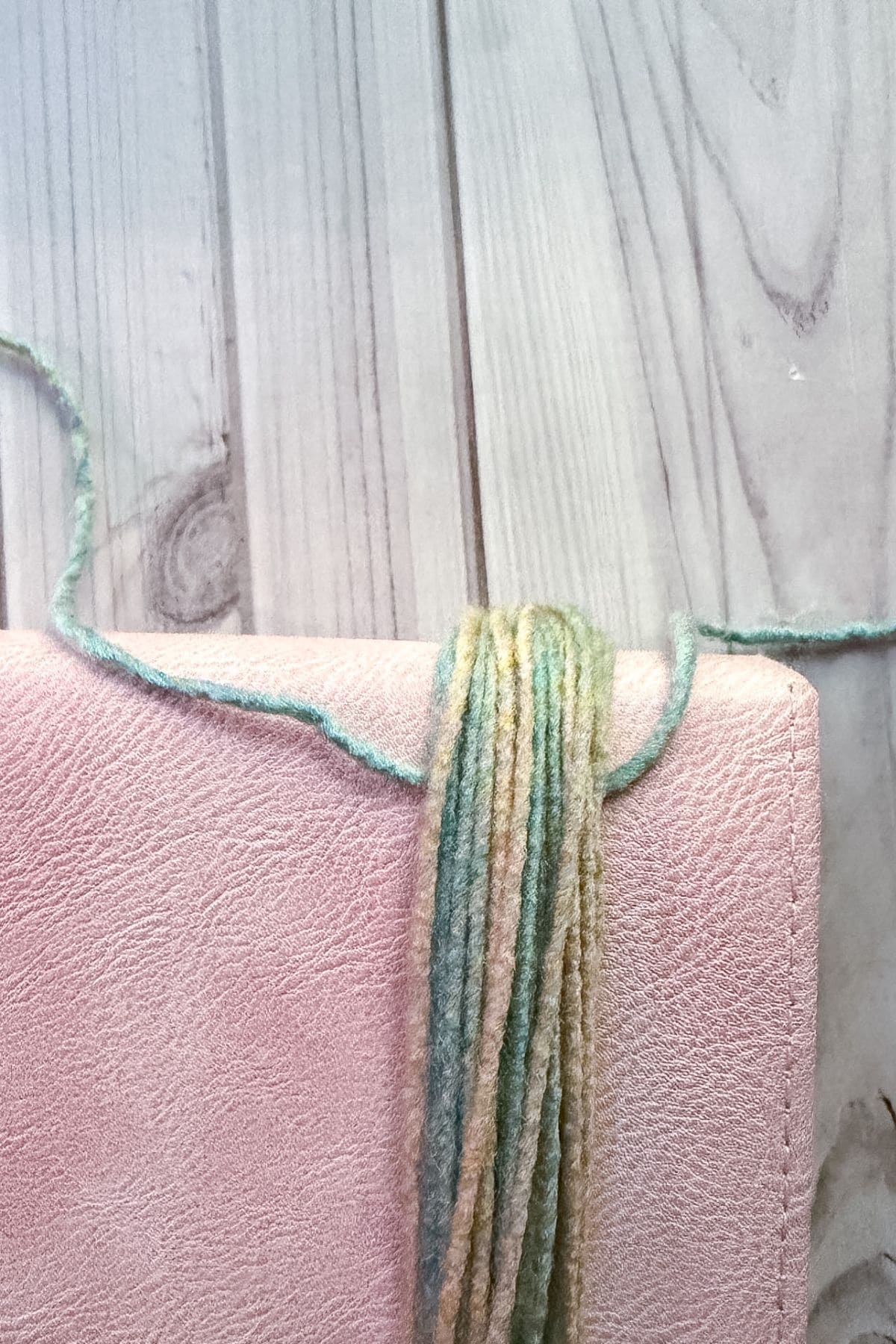 Starting to tie the tassel.