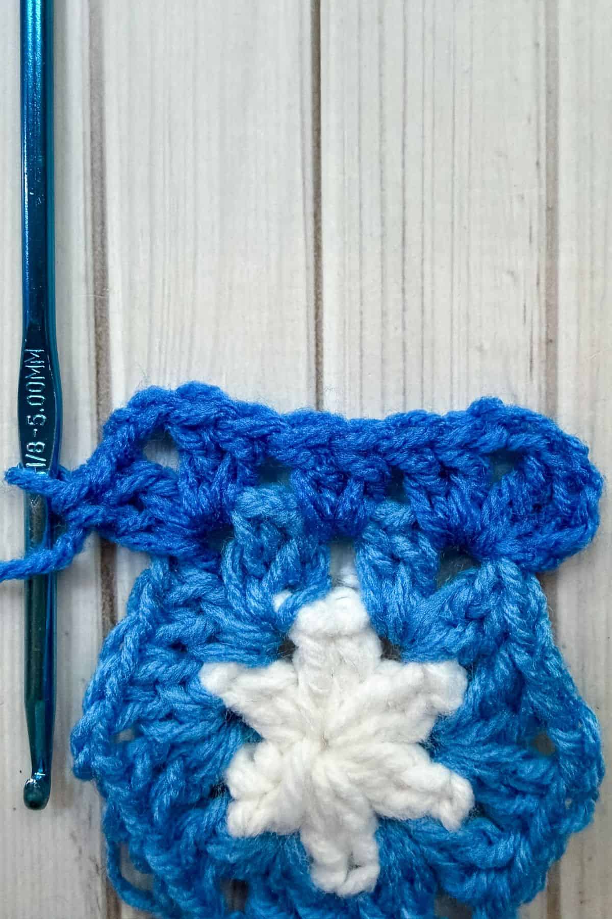 Starting round 3 of crochet hexagon.