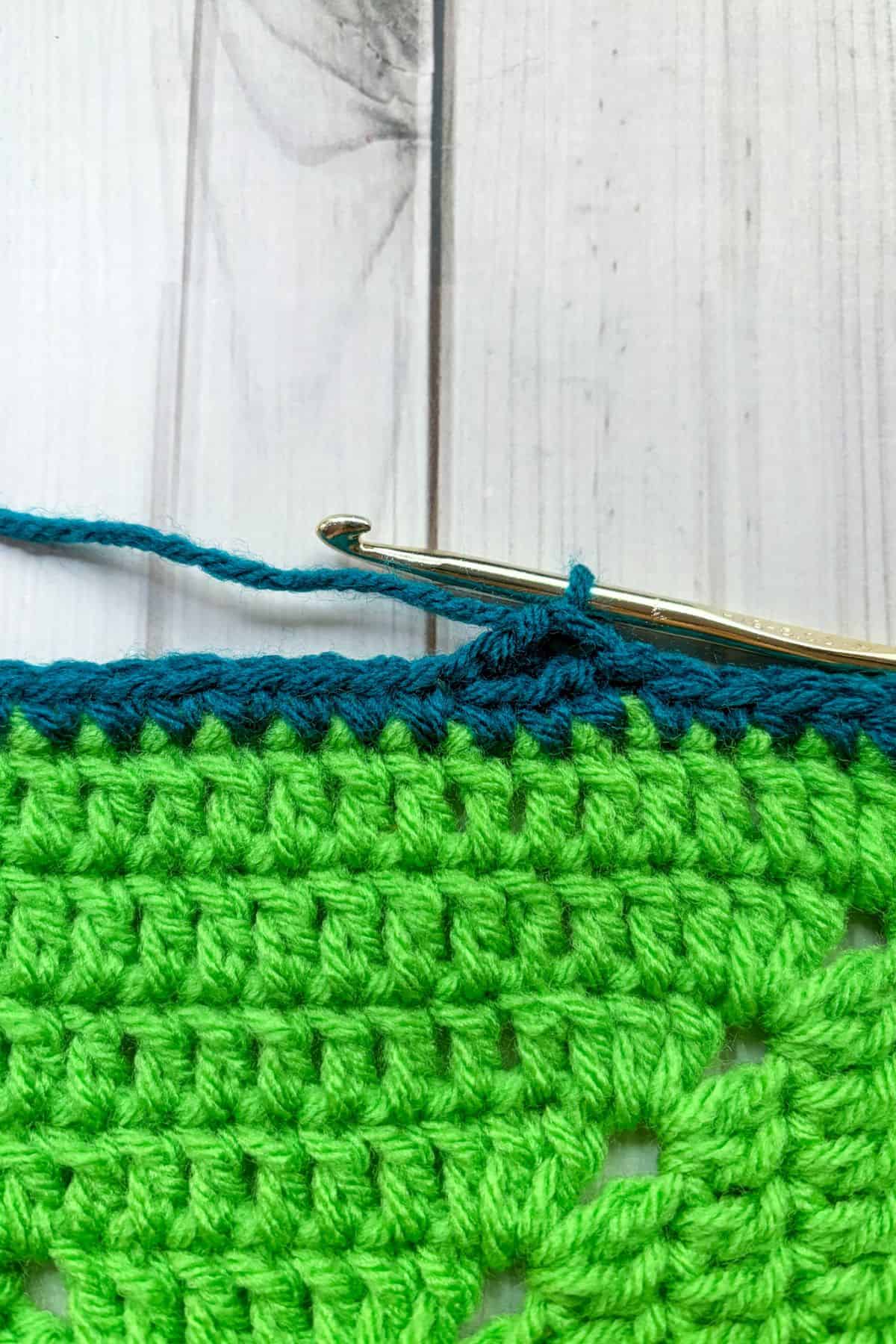 Close up of starting the shell stitch.