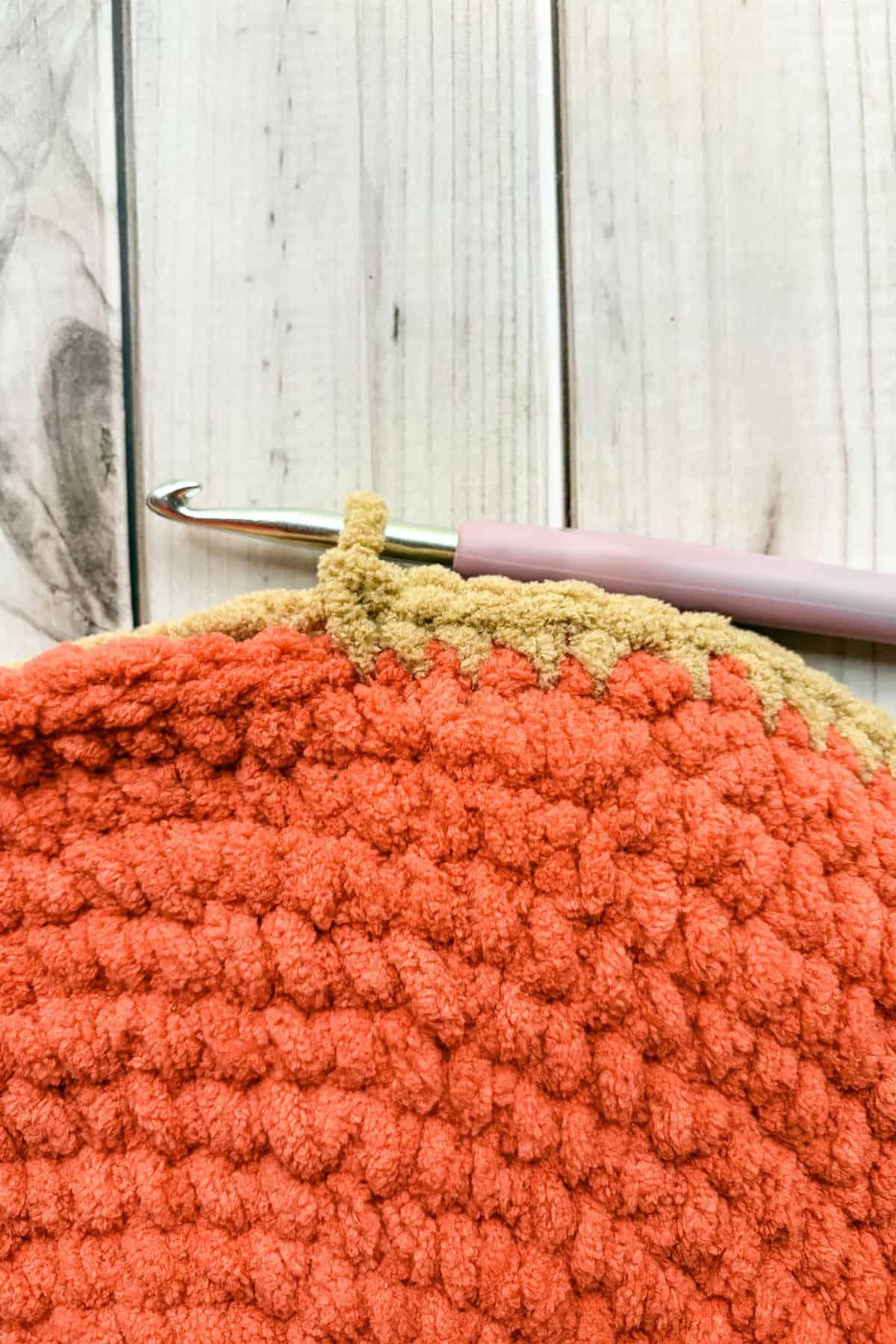 Crocheting the two circles together.